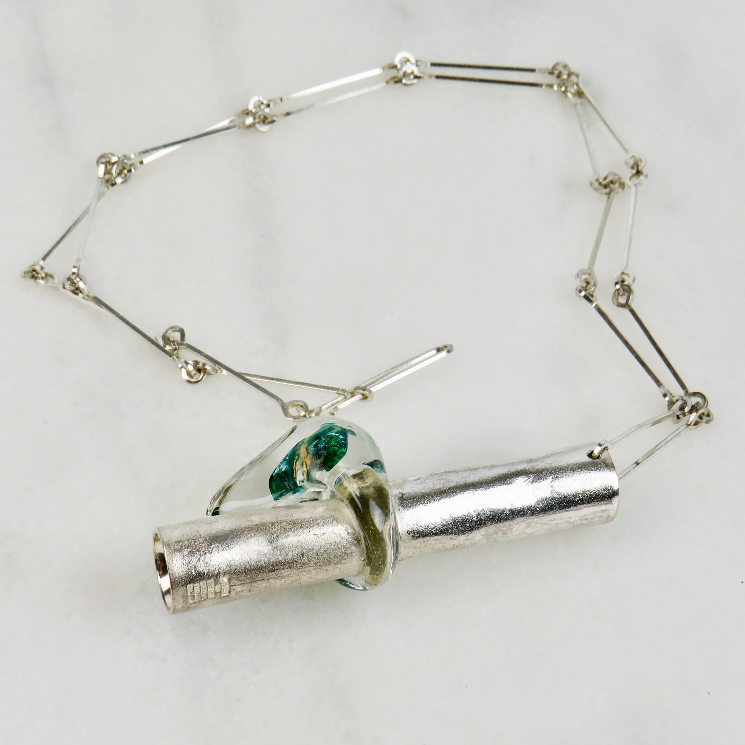 Fashionable silver chain with a simple trailer