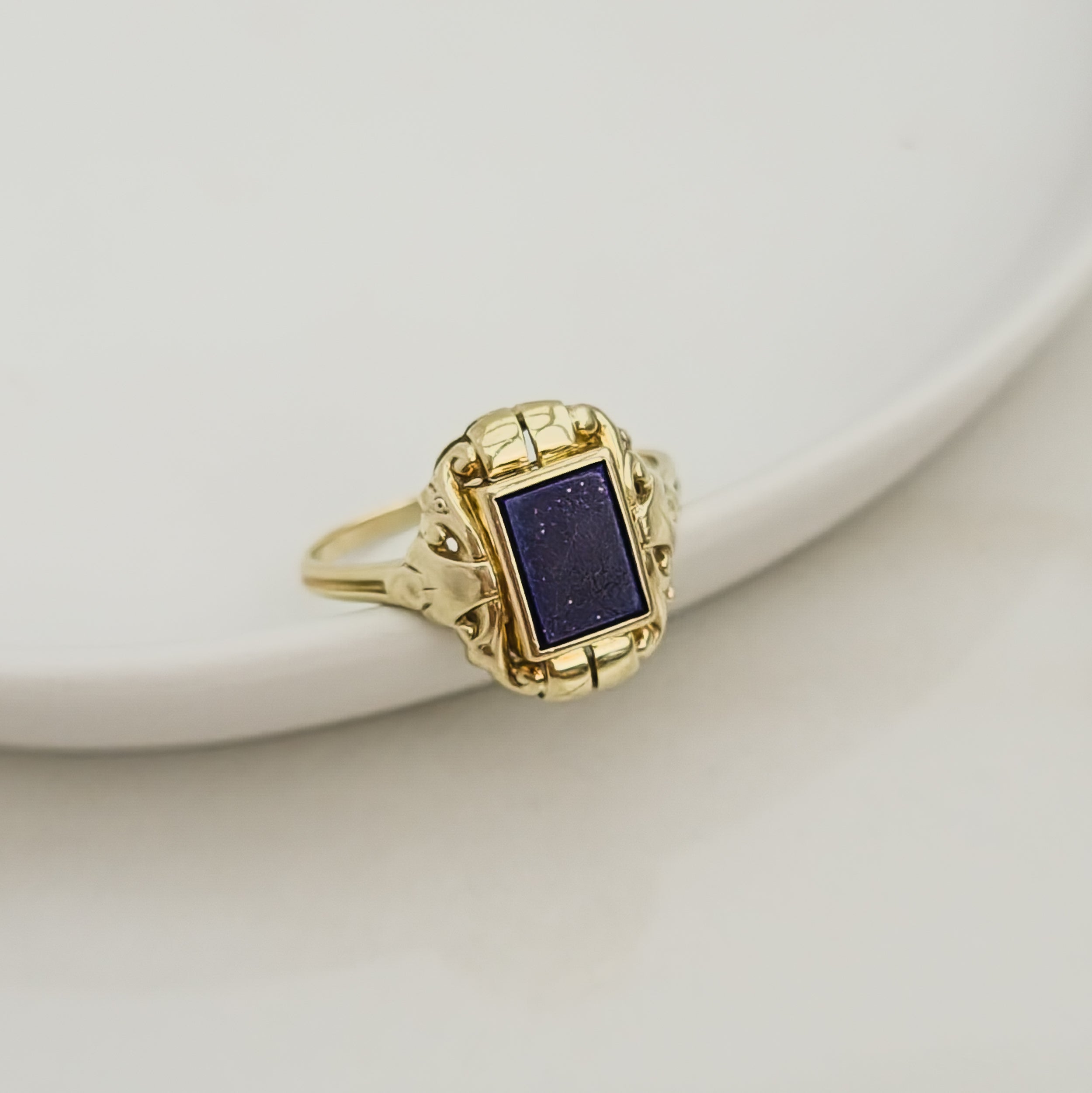 Antique gold ring with blue gemstone