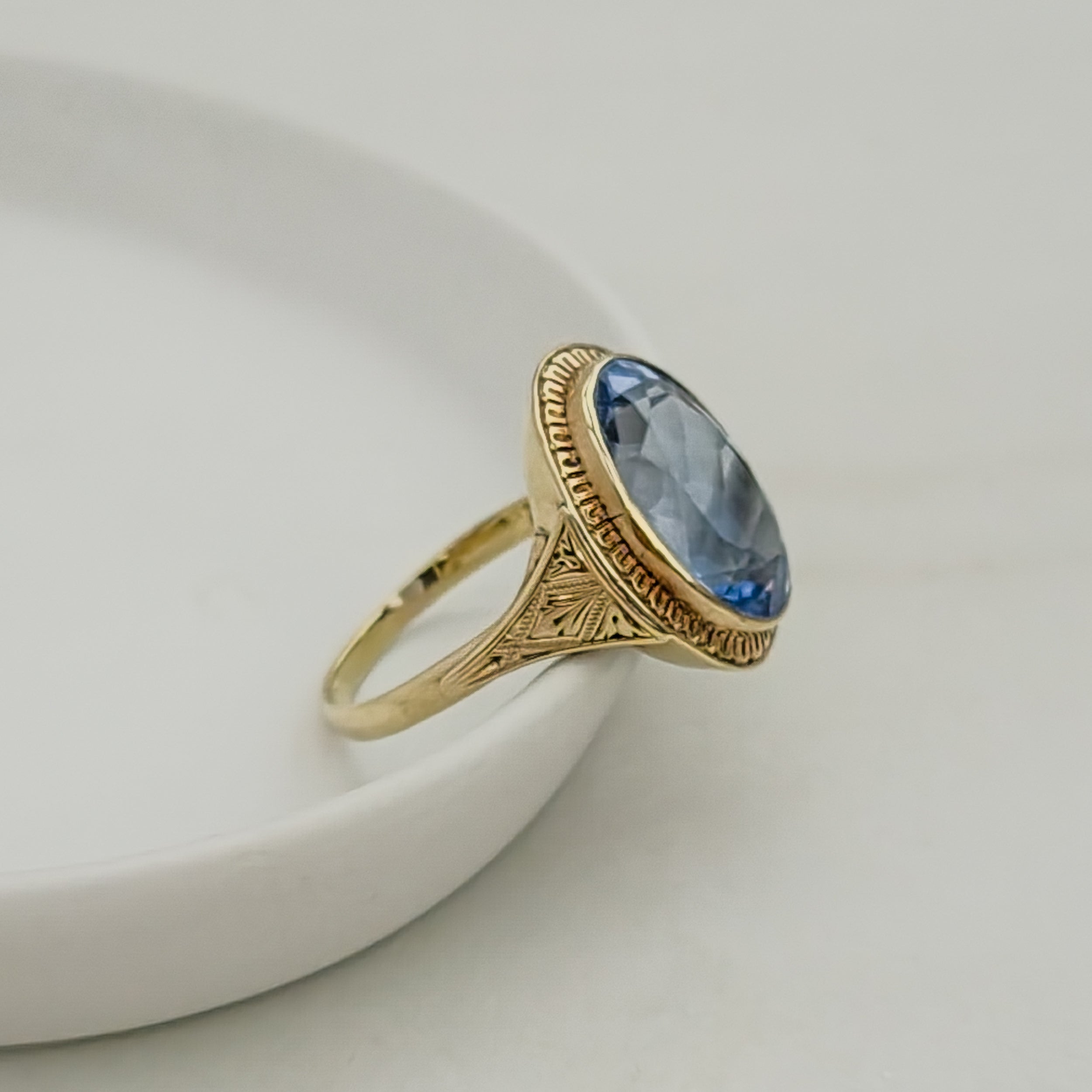 Antique gold ring with blue gemstone