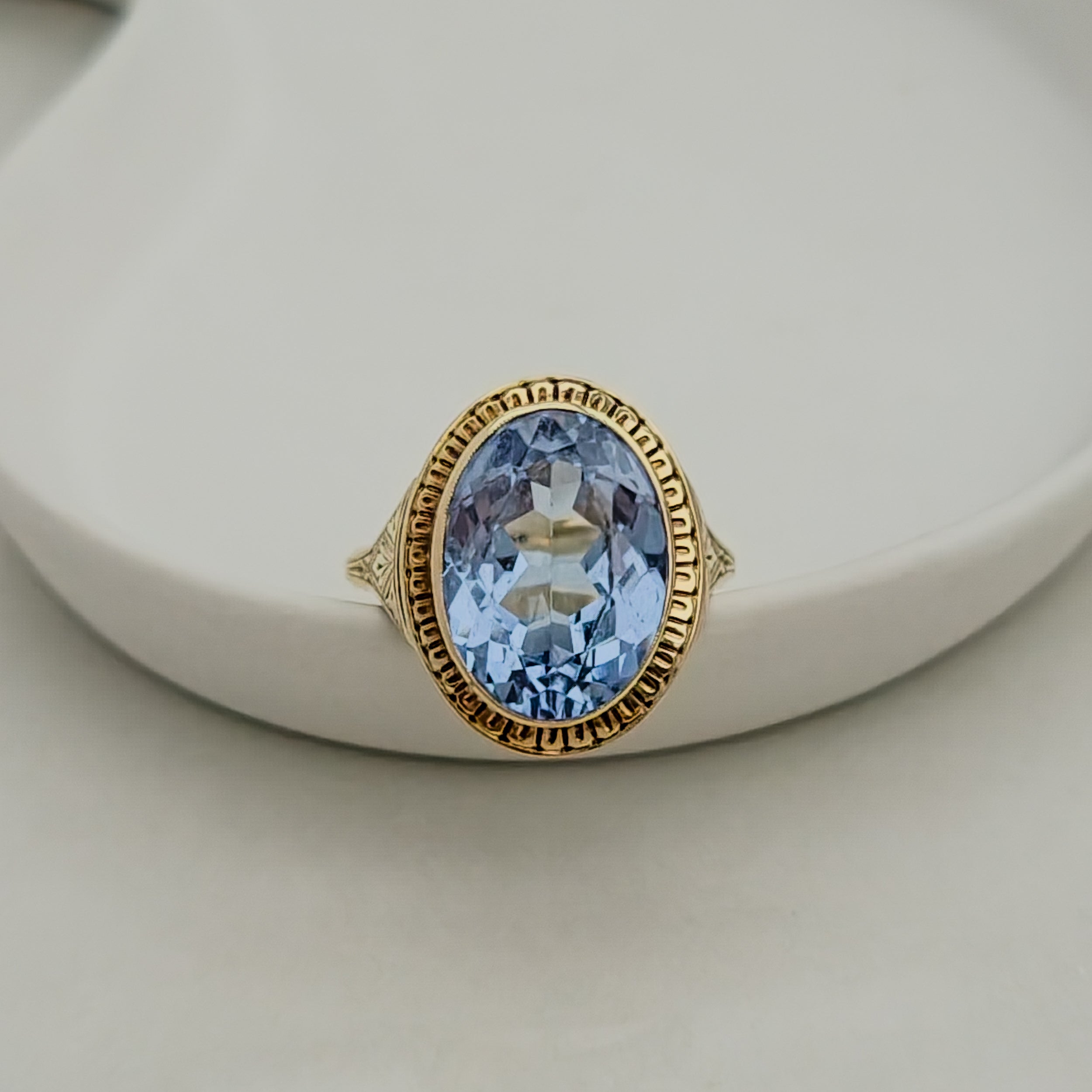 Antique gold ring with blue gemstone