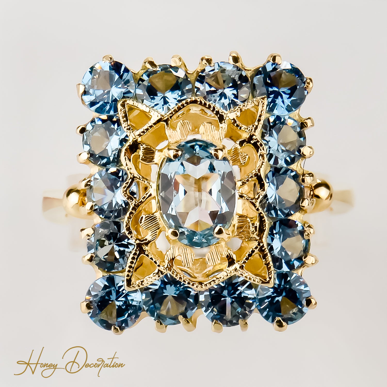 Vintage gold ring made of 18 carat yellow gold cast with blue gemstones