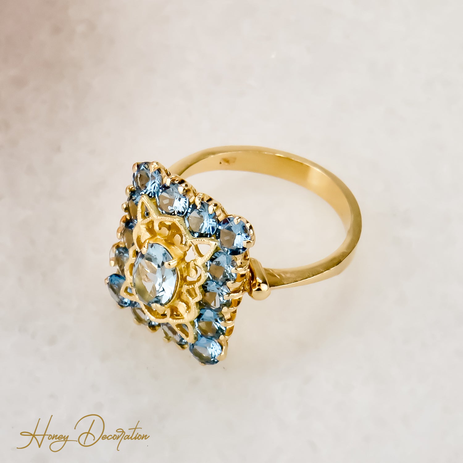 Vintage gold ring made of 18 carat yellow gold cast with blue gemstones