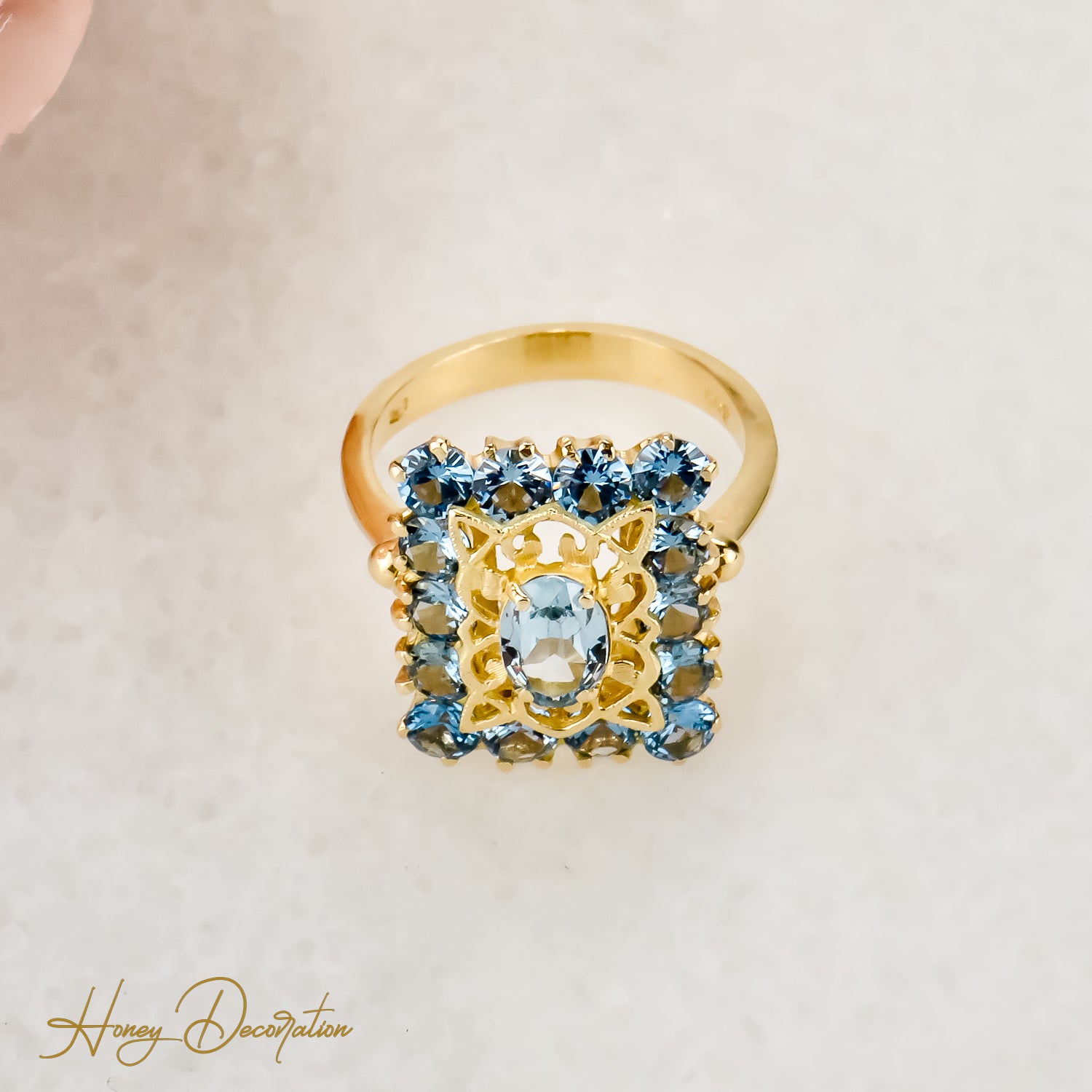 Vintage gold ring made of 18 carat yellow gold cast with blue gemstones